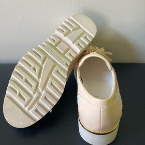 Beautiful women’s Franco Sarto Cream Loafers With Gold Accent. Never worn.